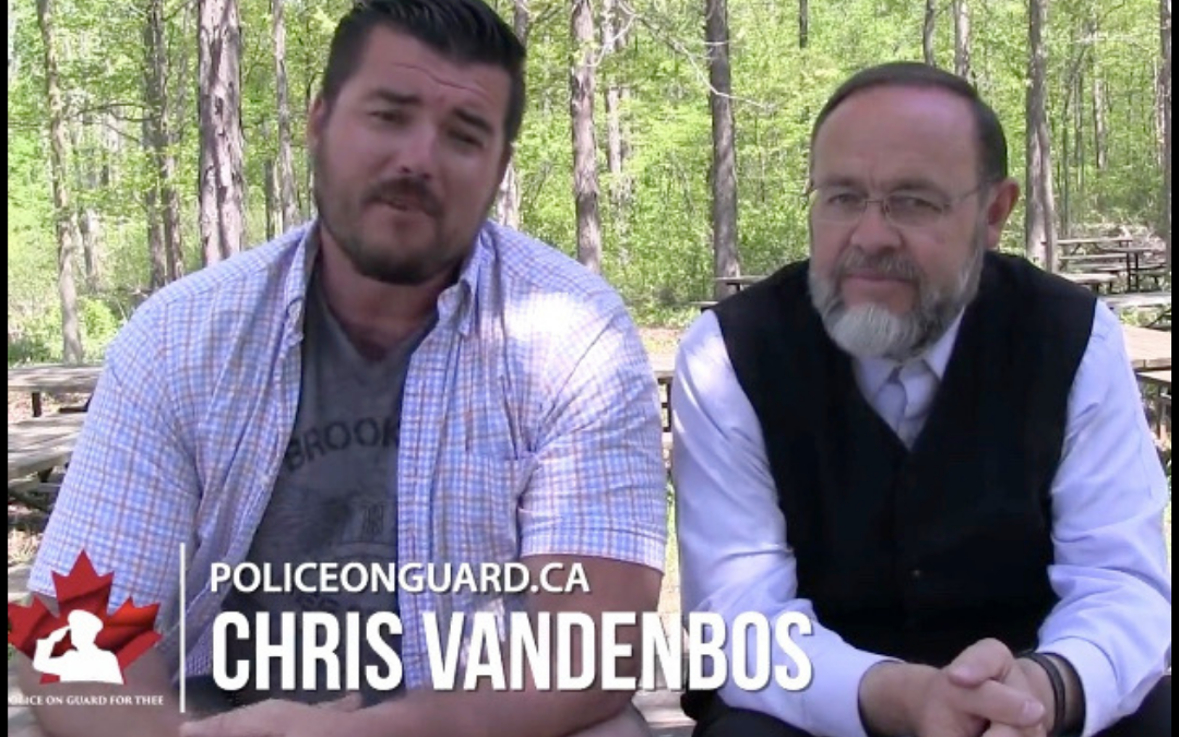 Police on Guard’s Chris VandenBos talks with Pastor Henry Hildebrandt